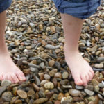 Walking barefoot on stones